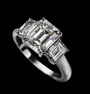 09 Carat Three Stone Emerald Cut Diamond Ring H  