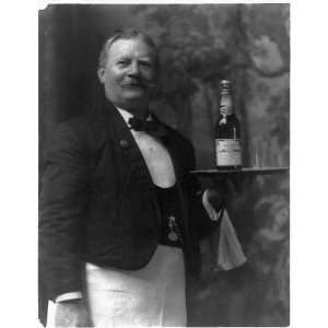  Waiter holding bottle of Budweiser beer on tray,c1908 