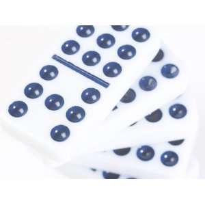  Pile of Black and White Dominoes Against White Background 