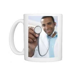  Doctor using a stethoscope Photo Mugs