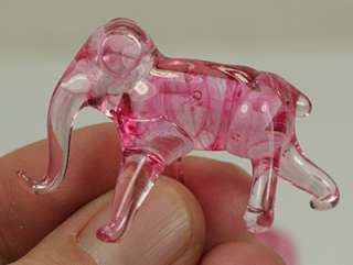 PAIR OF PINK GLASS ELEPHANT FIGURINES WITH UPTURNED TRUNKS  