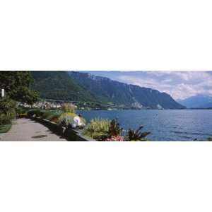 Man Sitting at the Lakeside, Lake Geneva, Montreux, Switzerland by 