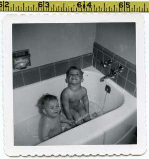   photo / Funny Brothers in Bath Tub   Bathing in Tiled Bathroom  
