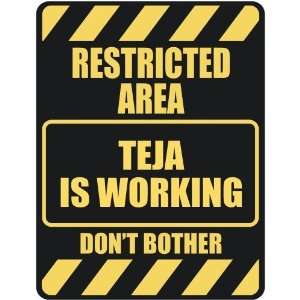   RESTRICTED AREA TEJA IS WORKING  PARKING SIGN