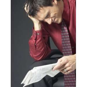  Man Reading Financial Pages and Stressing Photographic 