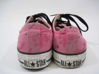   are bidding on a pair of CONVERSE Pink Canvas Sneakers in a Size 6