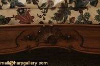 Expertly hand carved in France about 1900 of solid walnut, this 