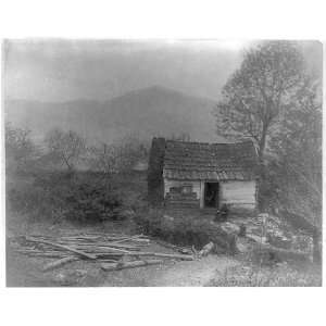 Sunday morning,Mountain White seated by log cabin,c1900  