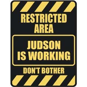   RESTRICTED AREA JUDSON IS WORKING  PARKING SIGN