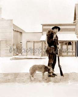 PHOTO OF EARLY WESTERN HUNTER AND HIS COYOTE ON A LEASH  