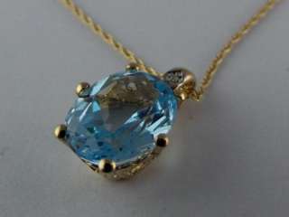Divine 9ct Gold Blue Topaz & Diamond Pendant. Fully Hallmarked 