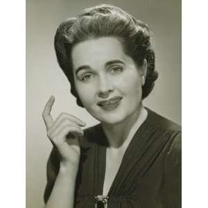  Young Woman With Raised Index Finger in Studio, Portrait 