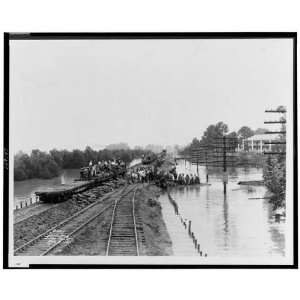  Workers unloading sandbags from railroad car,1927 Flood 